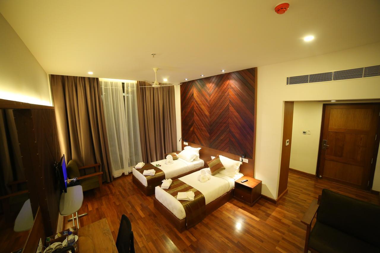 Woodies Bleisure Hotel Kozhikode Buitenkant foto